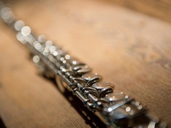 Though she never became a professional, Hilton learned how to play which musical instrument at age 5?